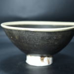 A black gazed teacup excavated in Sui-Tang Grand Canal site in Fengshan Road, Lingbi